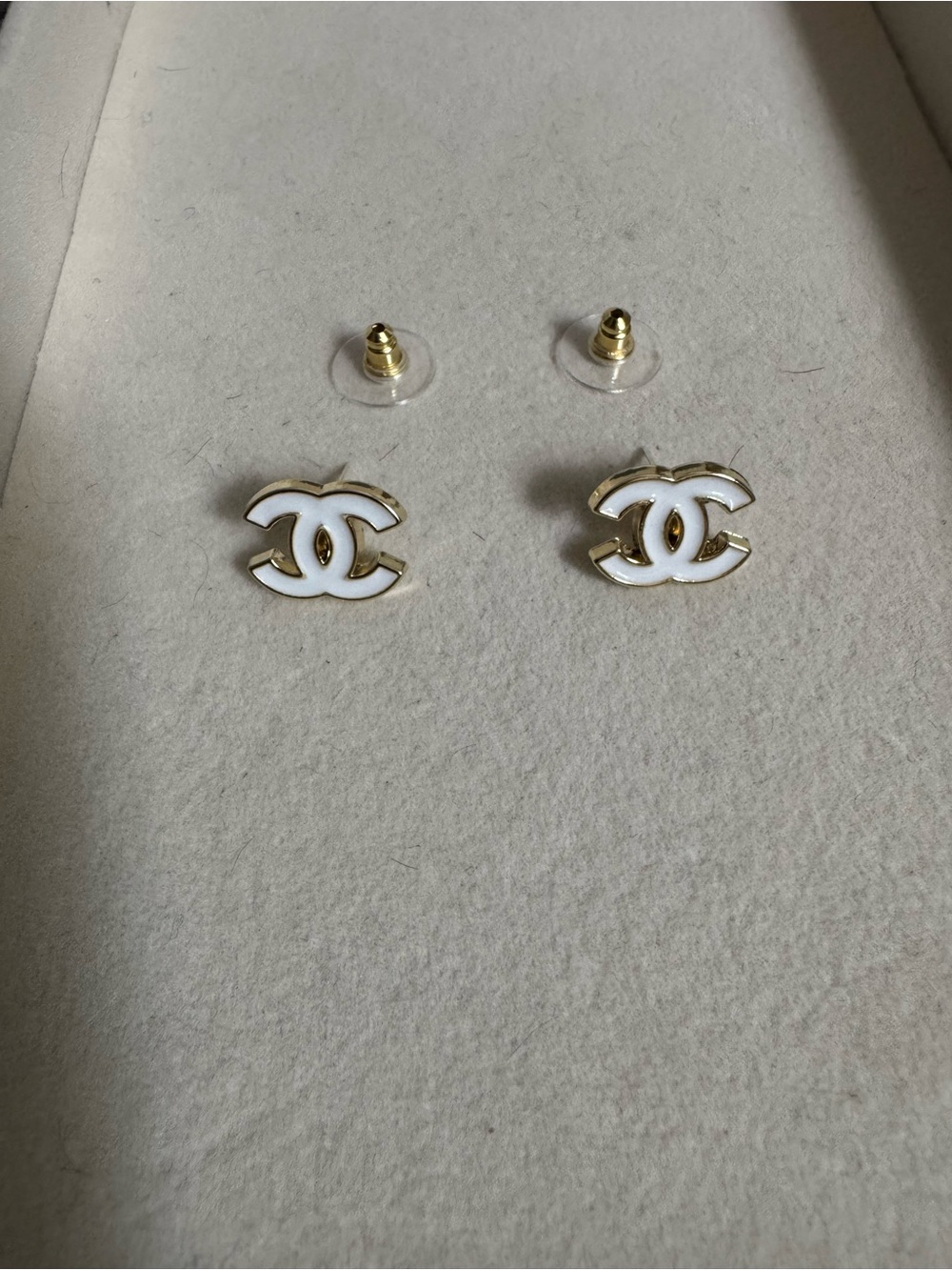 White & gold tiny stud earrings